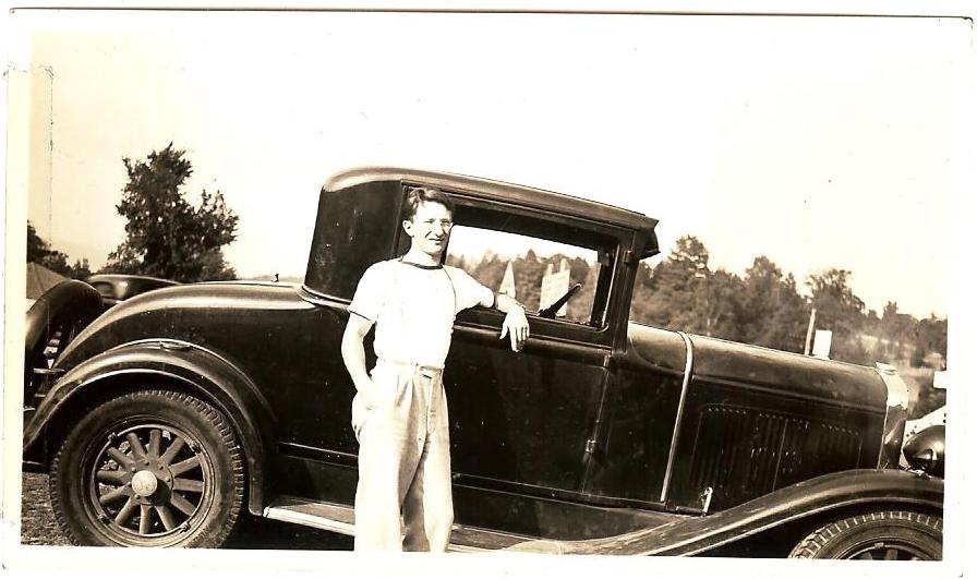 Photo of Edward W. Roman with his Desoto automobile
